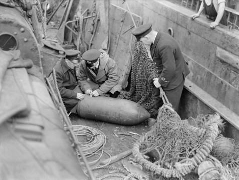 Defusing a bomb, 1941.